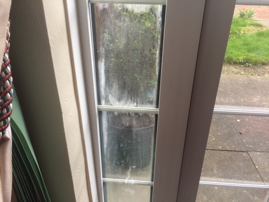 Misted Double Glazing Repair Georgian-style glazed panes clouded with internal condensation before repair